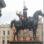 Uh oh. Santa's been arrested for climbing a giant horse statue