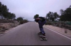 Longboarder has unbelievable near miss with bus