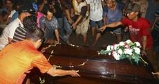 First victim of doomed AirAsia flight buried