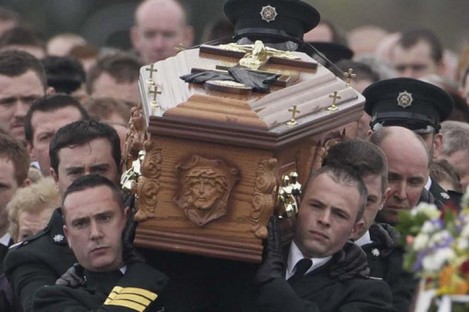 The coffin of PSNI officer Ronan Kerr is carried through his home town of Beragh, Co Tyrone, 6 April 2011.