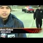 Cop has the uncoolest reaction ever when he realises he's in a live news shot