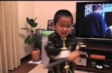 This little kid can almost perfectly imitate Bruce Lee's nunchaku moves