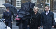 Are the people who run the country laughing at this woman being attacked by her brolly?
