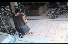 Watch this stealthy woman steal a TV by shoving it up her dress