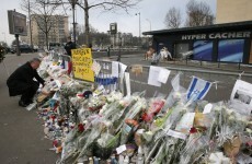 The Charlie Hebdo offices are still surrounded by tributes to slain journalists