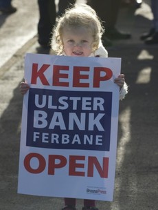 A community is taking to the streets today to stop its local bank from closing