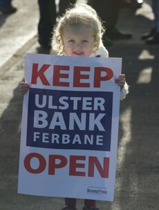 A community is taking to the streets today to stop its local bank from closing