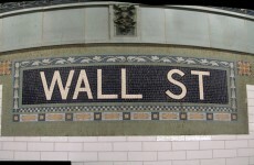 Three arrested as 30 strip naked on Wall Street