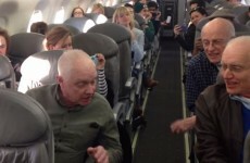 Incredible barbershop quartet serenades fellow passengers during plane delay