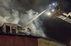 Bus driver helps naked man leap to safety from burning building