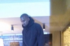 This photo of Kanye West standing on a counter in Nando's is going viral