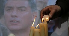 Putin vows to punish killers of Kremlin critic, as opposition condemns "political murder"