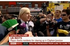 London mayor Johnson brandishes a broom on the streets of the city