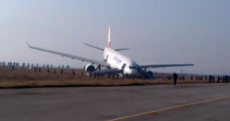 Plane carrying 224 passengers skids off runway, ends up on grass
