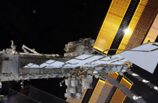 Can you spot the astronaut space-walking in this picture?