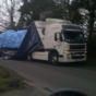 Lorry tries to make it under low bridge: Doesn't make it