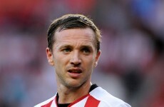 A former Irish international and footballing cult hero has announced his retirement