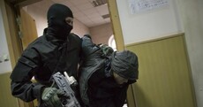 Pictures: Armed and masked police haul Nemtsov suspects before Moscow court