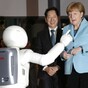 Angela Merkel had an uncomfortable encounter with a dancing robot today