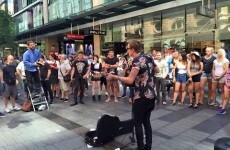 Busker drowns out homophobic preacher with rendition of Girls Just Wanna Have Fun