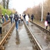 Passengers walk the track after power-cut stops some Luas trams