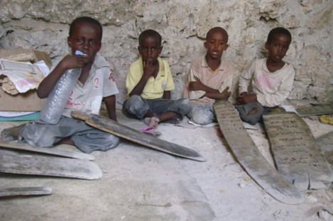 Somali boys read the Koran at a refugee camp in Mogadishu