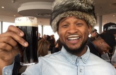 Usher is in Dublin, and sporting an excellent Guinness moustache