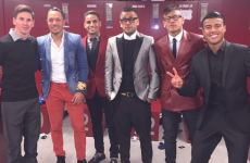 Somehow, Lionel Messi is the second best dressed person in this photo