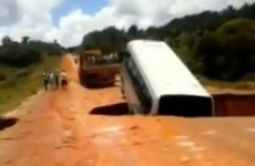 VIDEO: Bus swallowed by massive sinkhole, carried away on flooded river
