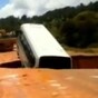 VIDEO: Bus swallowed by massive sinkhole, carried away on flooded river
