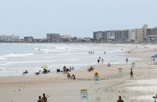 A suspect in a US college shooting has been found - asleep, at the beach