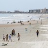A suspect in a US college shooting has been found - asleep, at the beach