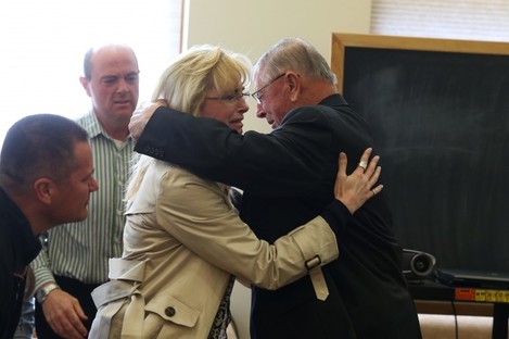 Henry Rayhons hugs members of his family after being found not guilty.