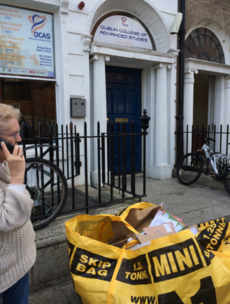 Photocopies of college students' passports left in a skip on busy street