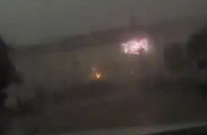 Violent storm blows train off elevated bridge