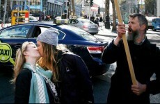 A photographer captured two girls defiantly kissing in front of a No protester in Dublin