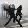 Police use tear gas on stone-throwing protesters