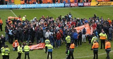 Blackpool's final game of abysmal season abandoned after fans invade pitch in protest