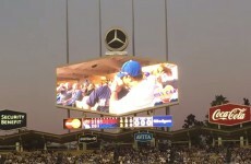 A gay couple embraced on a stadium kiss cam and the crowd loved it