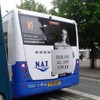 Bus company drops ad campaign that had topless woman with "Ride me all day" sign