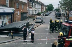 Billboard fell off wall and onto woman