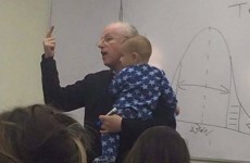 Here's why this photo of a professor holding his student's baby is going viral