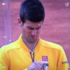 Djokovic nearly takes his eye out by showing how NOT to open a bottle of champagne