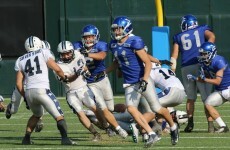 IBM employees form a football team with pro stadium, cheerleaders and televised games