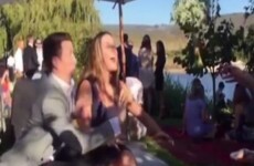 A boyfriend desperately tried to keep a bridal bouquet away from his girlfriend