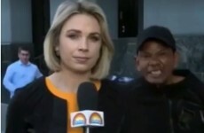 This reporter stayed totally cool as a man was arrested behind her on live TV