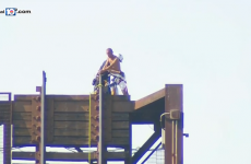 Police had to rescue a naked man who got himself stuck on a raised bridge