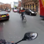 This cyclist had an incredibly close call with a bus after breaking a red light