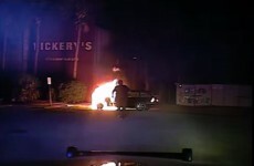 Watch: Incredible footage of police officer pulling drunk man from burning car