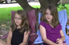 Police shut down these little girls' lemonade stand, because joy is illegal